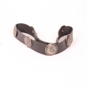 A dark leather belt adorned with five silver sunburst conchos