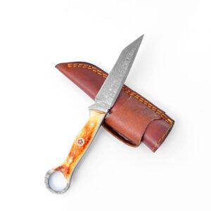Damascus knife with a decorated bone handle and finger hole, partially in a brown leather sheath with orange stitching
