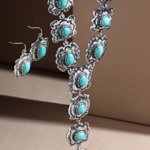 A silver-toned necklace and matching earrings, each featuring an oval turquoise stone in a decorative scalloped design