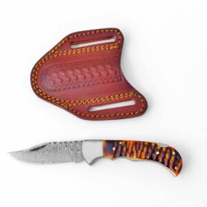 A folding knife with a wavy Damascus blade and patterned brown handle, next to an embossed brown leather sheath with yellow stitching