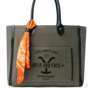 Olive green canvas tote bag with black leather handles, an orange paisley bandana, and a Yellowstone Dutton Ranch Wild and Free logo