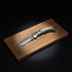 A knife with a patterned Damascus blade and a blue and light wood handle rests on a wooden board, dramatically lit